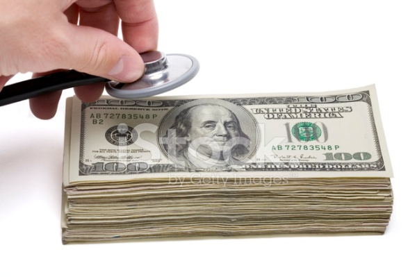 9423702-financial-health-money-and-stethoscope